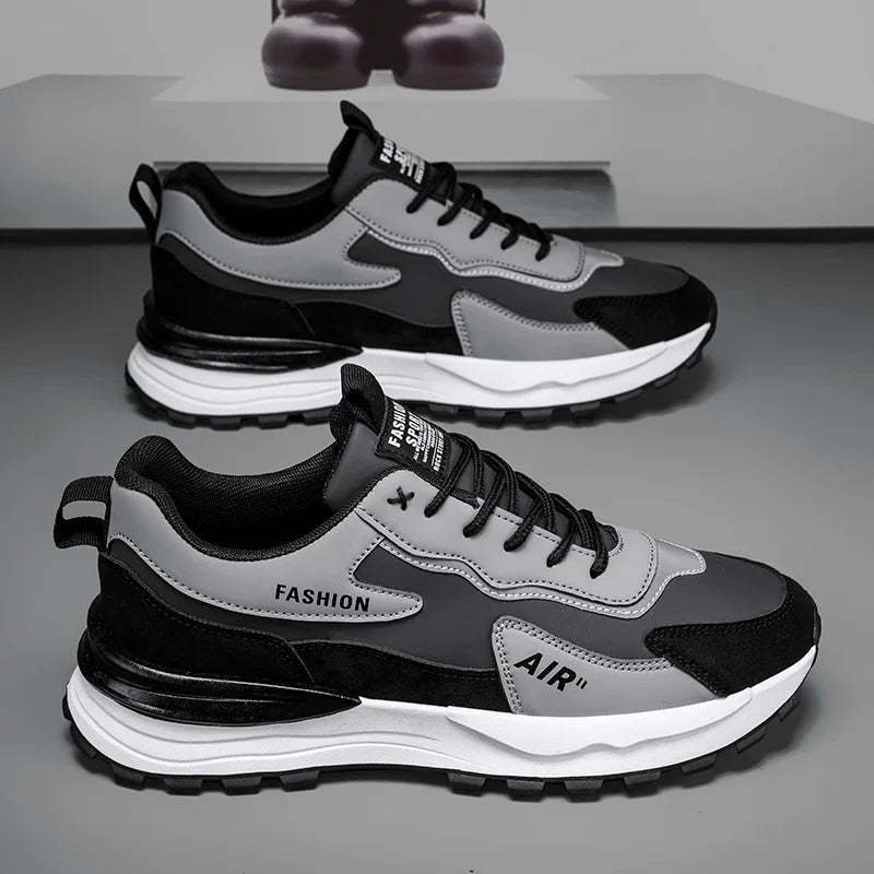 Tênis Casual Air Pro da Oron Store em fundo branco. Modelo unissex disponível nas cores branco e cinza, com cabedal em camurça e couro, e solado em borracha antiderrapante. Tênis casual com fechamento em cadarço, ideal para caminhadas, uso diário ou compor looks urbanos e confortáveis no verão 2025. Disponível nos tamanhos 37 ao 42.